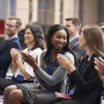 Audience Applauding Speaker After Conference Presentation