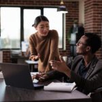 Diverse Team Of People Working On Laptop In Disability Friendly