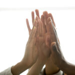 Motivated Multiracial Business Team Join Hands Palms Together, B